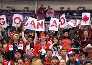 SOCHI, RUSSIA - FEBRUARY 13: Canadian fans cheers during the game opposing team Norway during men's preliminary round action at the Sochi 2014 Olympic Winter Games. (Photo by Andre Ringuette/HHOF-IIHF Images)

