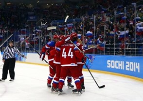 SOCHI, RUSSIA - FEBRUARY 13: Russia's Alexandra Kapustina #44 celebrates with teammates after a first period goal by Anna Shukina #21 against Sweden during women's preliminary round action at the Sochi 2014 Olympic Winter Games. (Photo by Jeff Vinnick/HHOF-IIHF Images)

