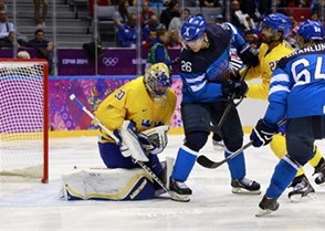 SOCHI, RUSSIA - FEBRUARY 21: Sweden's Henrik Lundqvist #30 makes the save while Finland's Jarkko Imonen #26 looks for a rebound during men's semifinal action at the Sochi 2014 Olympic Winter Games. (Photo by Jeff Vinnick/HHOF-IIHF Images)

